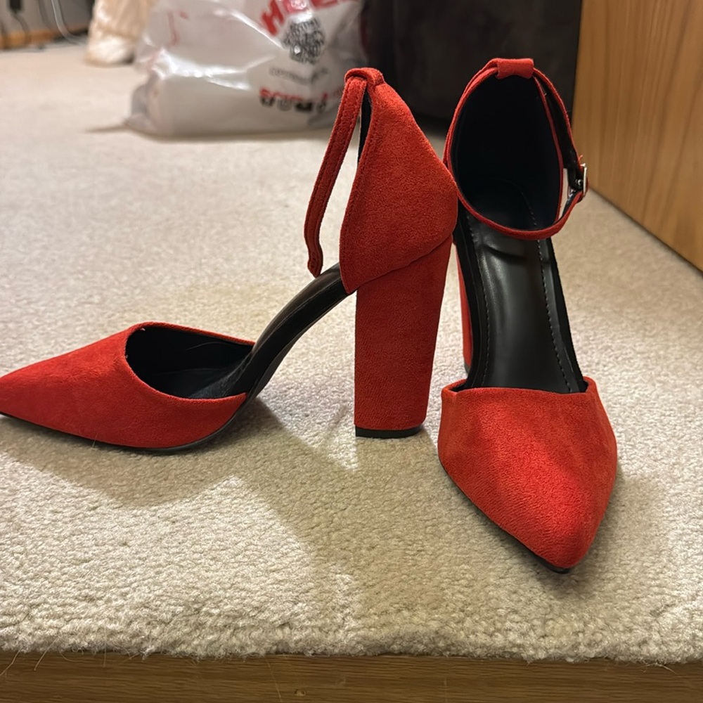 Red square heel shoes with close pointed toe with buckle strap